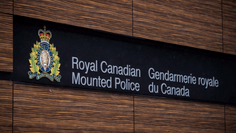 The RCMP logo is seen outside Royal Canadian Mounted Police "E" Division Headquarters, in Surrey, B.C., on Friday April 13, 2018. THE CANADIAN PRESS/Darryl Dyck 
