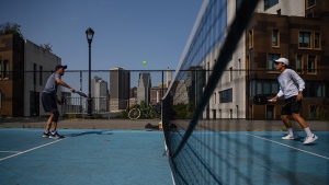People play pickleball at a public court in Brooklyn, New York in September 2022. (Ed Jones/AFP/Getty Images)