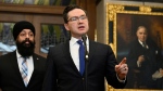 Conservative Leader Pierre Poilievre, centre, and Conservative MP Jasraj Singh Hallan, finance and middle class prosperity critic, participate in a news conference in the Foyer of the House of Commons on Parliament Hill in Ottawa, on Sunday, March 12, 2023. THE CANADIAN PRESS/Justin Tang