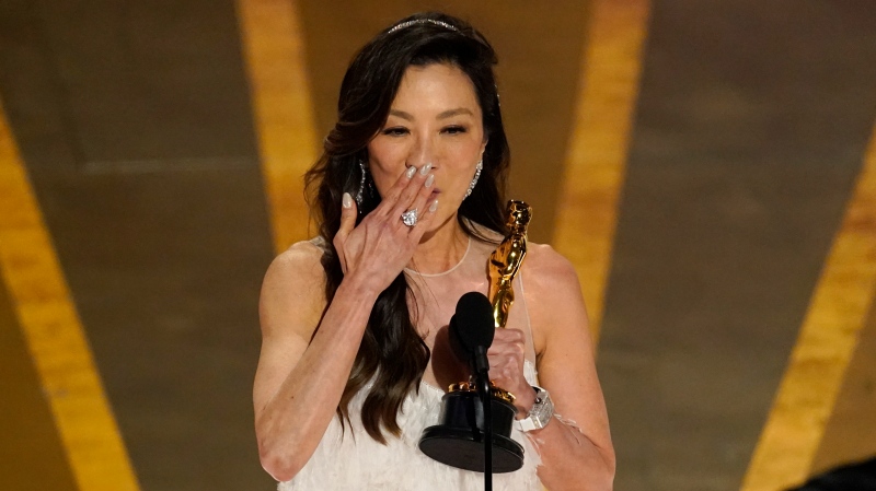 Michelle Yeoh accepts the award for best performance by an actress in a leading role for "Everything Everywhere All at Once" at the Oscars, March 12, 2023, at the Dolby Theatre in Los Angeles. (AP Photo/Chris Pizzello)
