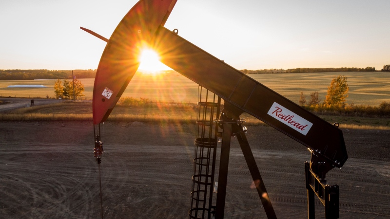 A pumpjack draws out oil and gas from a well head as the sun sets near Calgary, Alta., Sunday, Oct. 9, 2022. THE CANADIAN PRESS/Jeff McIntosh 