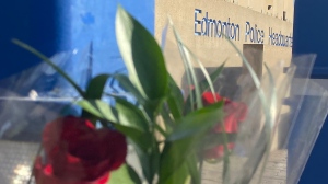 Roses were left outside Edmonton Police Service's downtown headquarters on March 16, 2023, after two officers were killed while responding to a domestic dispute in west Edmonton. 