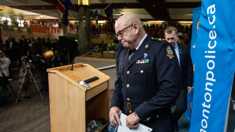 Edmonton Police Chief Dale McFee makes his way to speak to media about two police officers who were shot and killed on duty in Edmonton on Thursday, March 16, 2023. THE CANADIAN PRESS/Jason Franson 