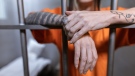 This undated stock photo shows a person in a prison cell. (Pexels)