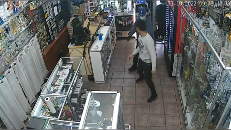 Surveillance video shows smoke shop robbery