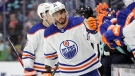 Edmonton Oilers left wing Evander Kane (91) is congratulated after scoring his third goal against the Seattle Kraken during the third period of an NHL hockey game, Saturday, March 18, 2023, in Seattle (AP Photo/John Froschauer).