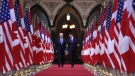 Prime Minister Justin Trudeau and then U.S. vice-president Joe Biden walk down the Hall of Honour on Parliament Hill in Ottawa on Dec. 9, 2016. Biden will once again sit down with Trudeau in Ottawa beginning Thursday, his first official visit to Canada as U.S. president. (THE CANADIAN PRESS/Patrick Doyle)