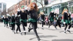 Irish dancers entertain the crowd during the St. Patrick's Day parade in Montreal, Sunday, March 19, 2023. THE CANADIAN PRESS/Graham Hughes