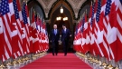 Prime Minister Justin Trudeau and US vice-president Joe Biden walk down the Hall of Honour on Parliament Hill in Ottawa on Friday, December 9, 2016. Biden will sit down with Trudeau in Ottawa beginning Thursday, his first official visit to Canada as U.S. president. THE CANADIAN PRESS/Patrick Doyle