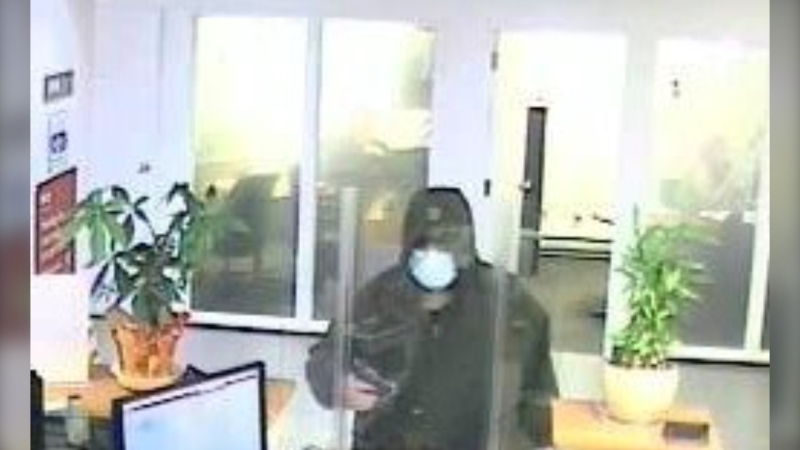 Surveillance footage released by the Lethbridge Police Service shows the suspect wanted in connection to an armed robbery on Friday, March 17, 2023 (Source: LPS).