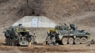 U.S. Army soldiers prepare for their exercise at a training field in Paju, South Korea, near the border with North Korea, Friday, March 17, 2023. (AP Photo/Ahn Young-joon)