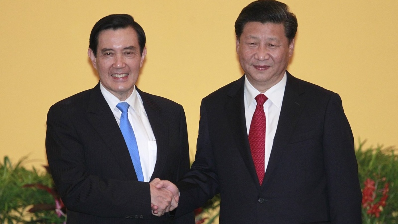 Then Taiwan's President Ma Ying-jeou, left, and China's President Xi Jinping shake hands at the Shangri-la Hotel on Nov. 7, 2015, in Singapore. (AP Photo/Chiang Ying-ying)