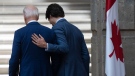 Prime Minister Justin Trudeau puts his hand on United States President Joe Biden as they talk while leaving the joint news conference at the North American Leaders Summit Tuesday, January 10, 2023 in Mexico City, Mexico. THE CANADIAN PRESS/Adrian Wyld