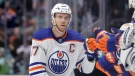 Edmonton Oilers centre Connor McDavid (97) celebrates after his goal against the Seattle Kraken during the third period of an NHL hockey game, Saturday, March 18, 2023, in Seattle. (AP Photo/John Froschauer)