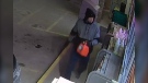 A "person of interest" in the Feb. 21, 2023, homicide of Robert Zibauer in Grande Cache, Alta., is seen in this Feb. 18, 2023, photo at a Hinton gas station. (Provided by RCMP.)