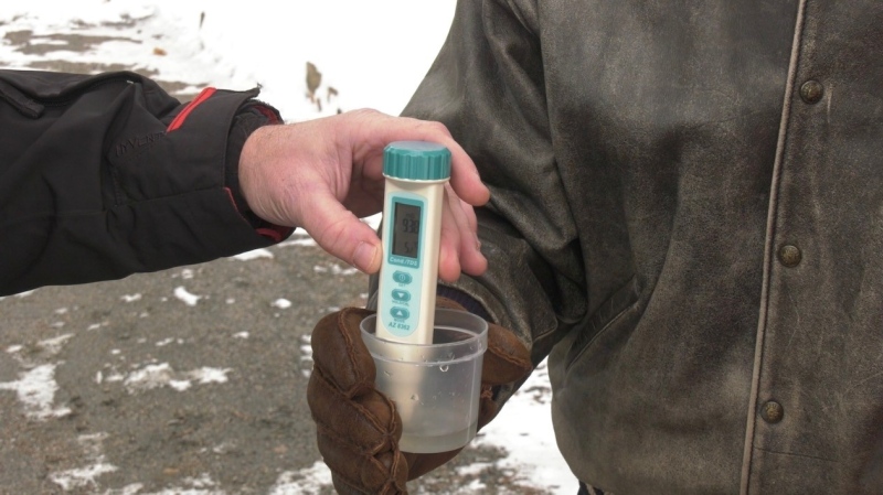 Water samples are collected in a stream close to Gull Lake in Muskoka on Mon., March 20, 2023. (CTV News/Molly Frommer)