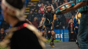 A young First Nations dancer performs during the Junior All Native Tournament basketball tournament, in Nanaimo, B.C., in a Sunday, March 19, 2023, handout photo. (THE CANADIAN PRESS/HO-SNUNEYMUXW, Nelson Campana)