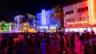 Crowds walk up and down Ocean Drive during spring break on Saturday, March 18, 2023, in Miami Beach, Fla. (D.A. Varela/Miami Herald via AP)