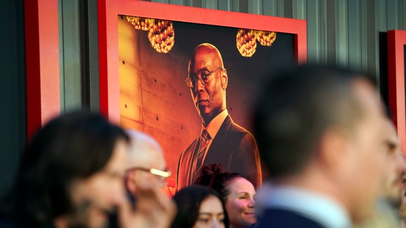A poster of the late Lance Reddick, a cast member in "John Wick: Chapter 4," hangs on a backdrop at the premiere of the film, March 20, 2023, at the TCL Chinese Theatre in Los Angeles. (AP Photo/Chris Pizzello)