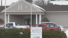 Walser Funeral Home in Kitchener is seen with a zone change notice sign.