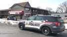 Police cruisers are seen in front of a Kitchener motel on Victoria Street on March 21, 2023. (Dan Lauckner/CTV Kitchener)