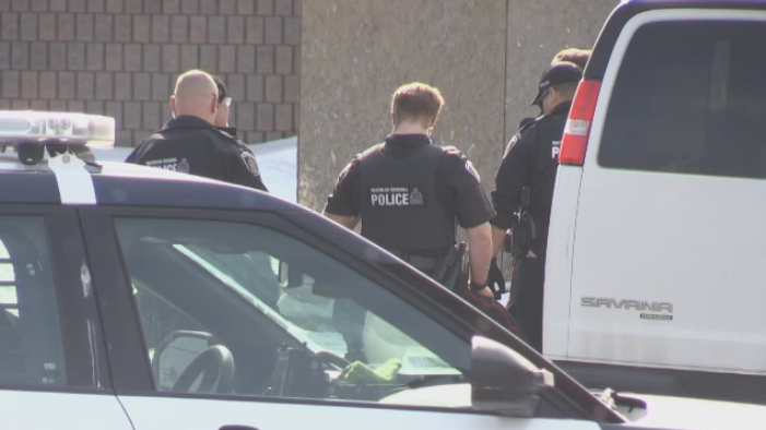 Officers are seen at a motel on Victoria Street in Kitchener on March 21, 2023. (Dan Lauckner/CTV Kitchener)