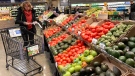 Shoppers pick out items at a grocery store in Glenview, Ill., Saturday, Nov. 19, 2022. (AP Photo/Nam Y. Huh)