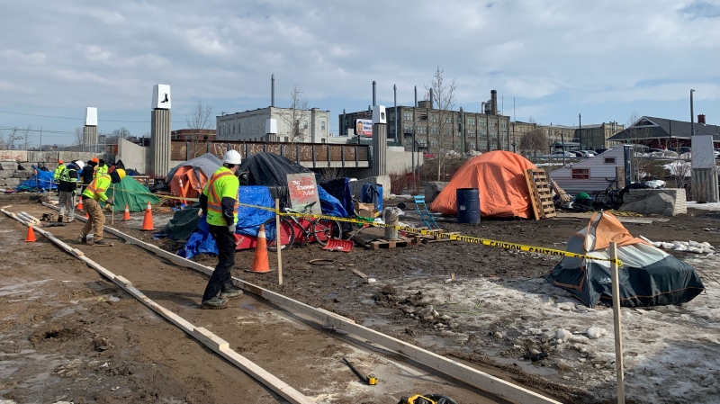 Crews are working at the Kitchener encampment to build pathways as the spring weather creates muddy conditions. (Krista Simpson/CTV News Kitchener)