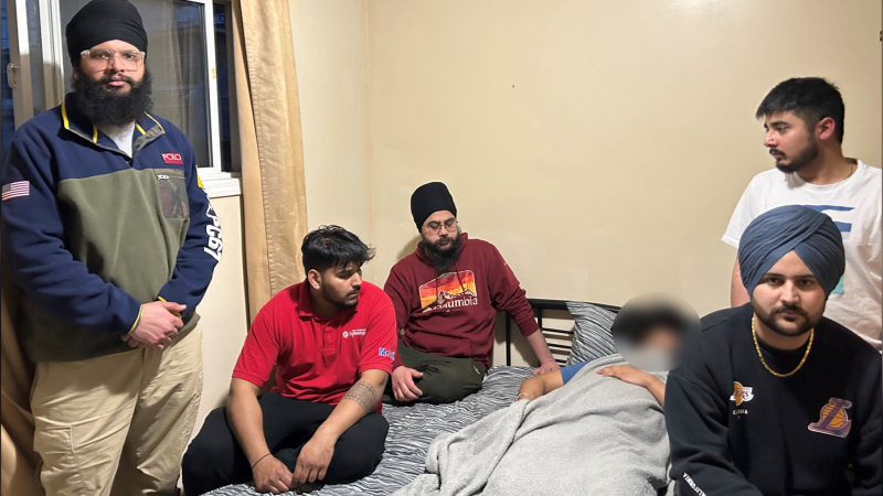 Gagandeep Singh is surrounded by friends in his home as he recovers from an assault that a city councillor believes should be investigated as a hate crime. (Photo submitted by Mohini Singh)
