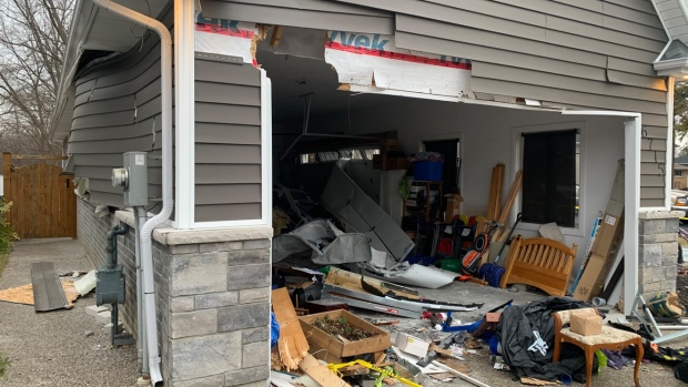 Car strikes home in LaSalle, Ont., on Wednesday, March 22, 2023. (Bob Bellacicco/CTV News Windsor)