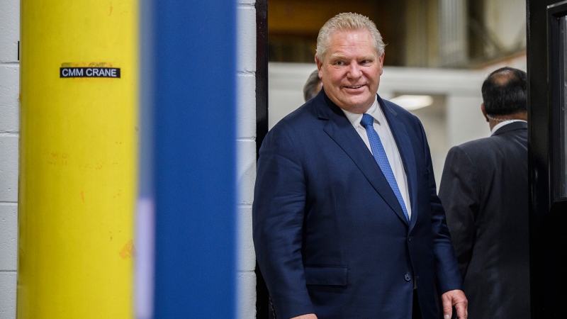 Ontario Premier Doug Ford tours a laboratory ahead of an announcement at a Magna International production facility, in Brampton, Ont., on Wednesday, February 15, 2023. THE CANADIAN PRESS/Christopher Katsarov 
