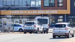 Police monitor the situation at Charles P. Allen High School in Halifax, Monday, March 20, 2023. THE CANADIAN PRESS/Riley Smith 