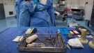 Sterile instruments are laid out as a male patient is prepped to have a cyst removed from his right knee at the Cambie Surgery Centre, in Vancouver on Wednesday, August 31, 2016. THE CANADIAN PRESS/Darryl Dyck