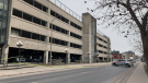 Police tape was put up at the parking garage for the Hotel Dieu Hospital in downtown Kingston, Ont. March 22, 2023. The Special Investigations Unit is investigating the circumstances of a man's death after he fell from the floor storey of the garage. (Kimberley Johnson/CTV News Ottawa)