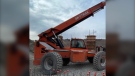 The complainant told Mounties a man was caught on video breaking into and stealing "a massive orange Skytrak Telehandler 10054" from the site. (Kelowna RCMP)