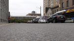 Vehicles wait for a train to cross Richmond Row at the location where a driver was stabbed during the afternoon of March 21, 2023. (Gerry Dewan/CTV News London)