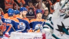Edmonton Oilers' Connor McDavid (97), Mattias Ekholm (14) and Evan Bouchard (2) celebrate a goal against the San Jose Sharks during second period NHL action in Edmonton on Monday March 20, 2023.THE CANADIAN PRESS/Jason Franson