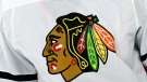 In this May 3, 2021, file photo, the Chicago Blackhawks logo is displayed on a jersey in Raleigh, N.C. (AP Photo/Karl B DeBlaker, File)