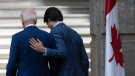 Prime Minister Justin Trudeau puts his hand on United States President Joe Biden as they talk while leaving the joint news conference at the North American Leaders Summit Tuesday, January 10, 2023 in Mexico City, Mexico. THE CANADIAN PRESS/Adrian Wyld 