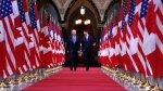 Prime Minister Justin Trudeau and then-U.S. vice-president Joe Biden walk down the Hall of Honour on Parliament Hill in Ottawa on December 9, 2016. (Patrick Doyle / THE CANADIAN PRESS)