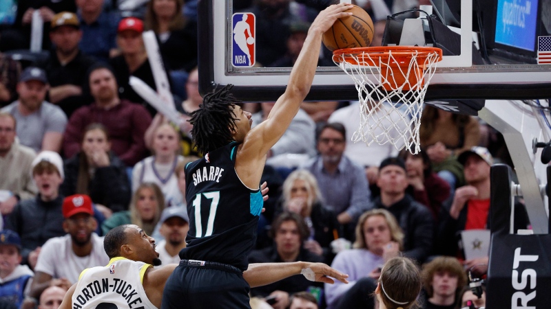 Portland Trail Blazers guard Shaedon Sharpe (17) dunks the ball against Utah Jazz guard Talen Horton-Tucker (0) and forward Kelly Olynyk in the second half of an NBA basketball game, Wednesday, March 22, 2023, in Salt Lake City. (SOURCE: AP Photo/Jeff Swinger)