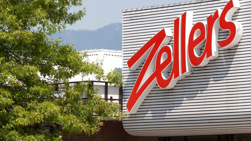 Customers are seen coming out of a Zellers store in North Vancouver, B.C., July, 26, 2012. THE CANADIAN PRESS/Jonathan Hayward