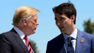 Prime Minister Justin Trudeau, right, greets then-U.S. president Donald Trump during the official welcoming ceremony at the G7 Leaders Summit in La Malbaie, Que., on Friday, June 8, 2018. THE CANADIAN PRESS/Sean Kilpatrick