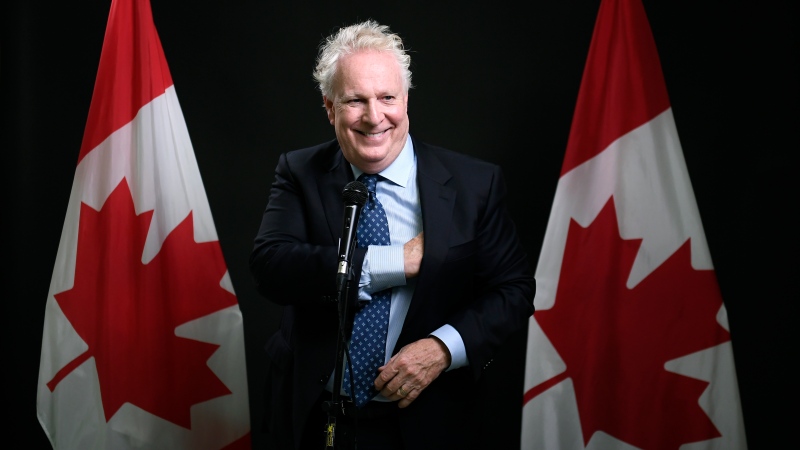 Conservative Leadership candidate Jean Charest jokes with reporters as he arrives for a media scrum after the third debate of the 2022 Conservative Party of Canada leadership race, in Ottawa, on Wednesday, Aug. 3, 2022. THE CANADIAN PRESS/Justin Tang