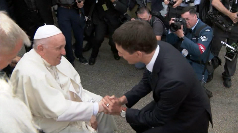 Pope Francis and Canadian Prime Minister Justin Trudeau shake hands during the 2022 papal visit. 