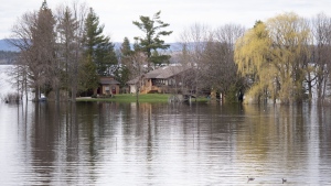 A home off of Beachburg Road by the Ottawa River in Whitewater Region, east of Pembroke, Ontario is completely surrounded by water as flooding continues in the region, on Saturday, May 11, 2019. Community organizations and municipalities in Ontario could get a piece of $110 million in funding the province has committed over three years for emergency readiness.THE CANADIAN PRESS/Justin Tang