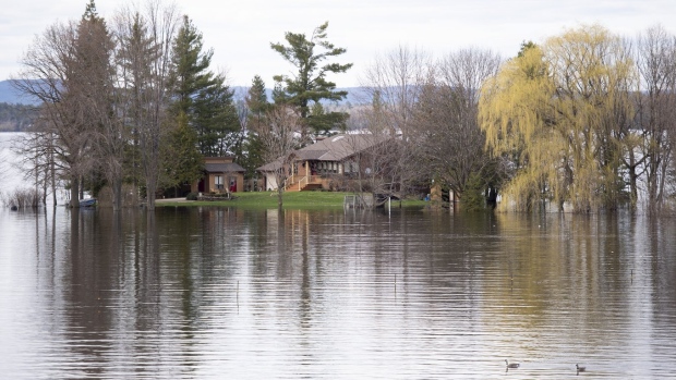 A home off of Beachburg Road by the Ottawa River in Whitewater Region, east of Pembroke, Ontario is completely surrounded by water as flooding continues in the region, on Saturday, May 11, 2019. Community organizations and municipalities in Ontario could get a piece of $110 million in funding the province has committed over three years for emergency readiness.THE CANADIAN PRESS/Justin Tang