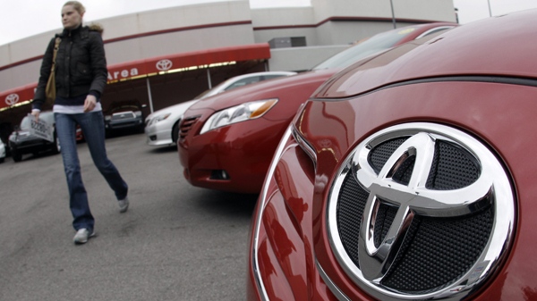 A customer walks past a new 2010 Toyota Camry at a dealership in Nashville, Tenn., on Wednesday, Jan. 27, 2010. (AP / Mark Humphrey)