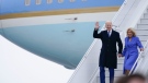 President Joe Biden waves as he and first lady Jill Biden exit Air Force One as they arrive at Ottawa International Airport, Thursday, March 23, 2023, in Ottawa, Canada. (AP Photo/Andrew Harnik)