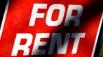 A stock photo shows a sign advertising a rental property. 